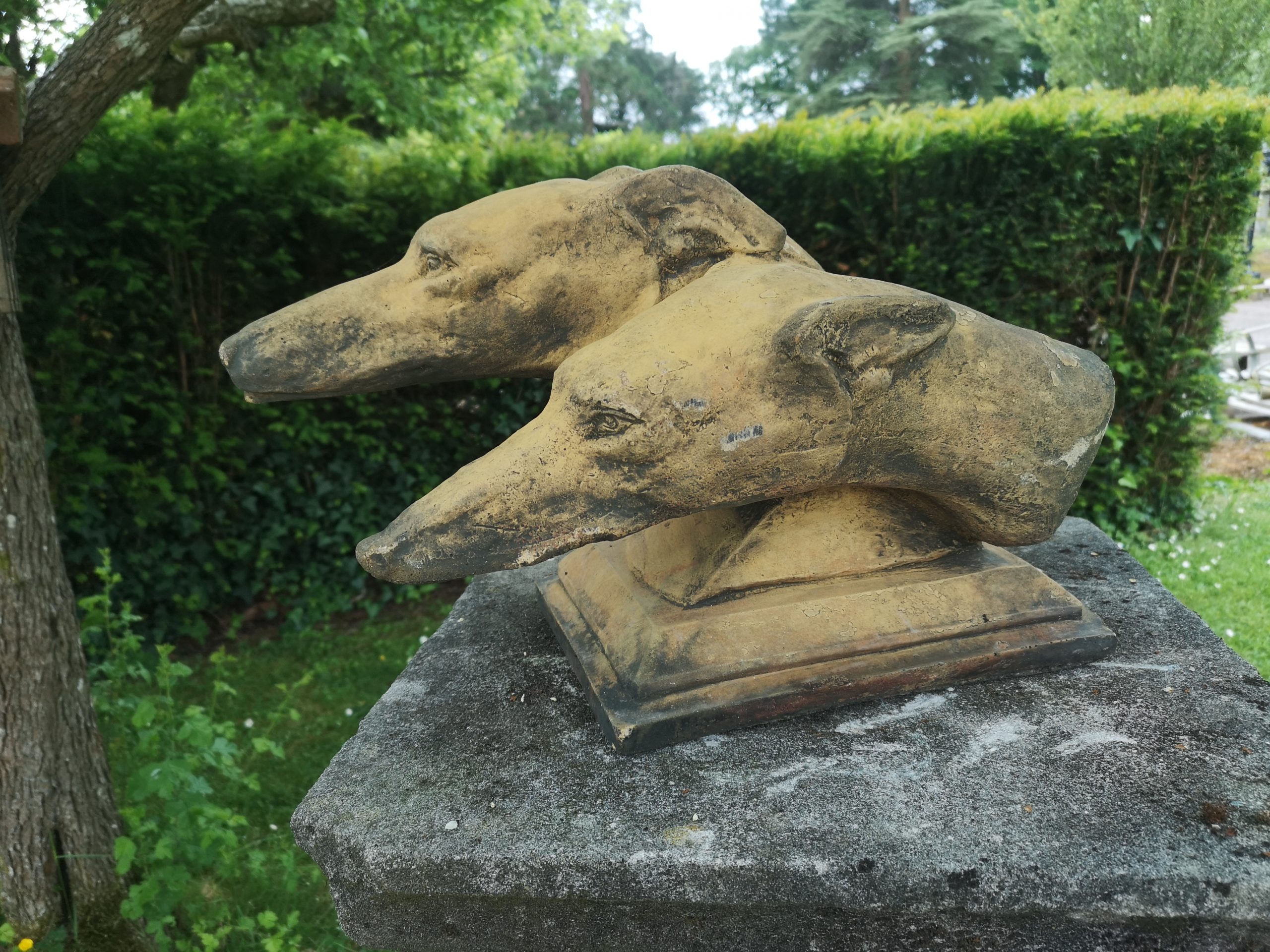 Two composition stone greyhound head's