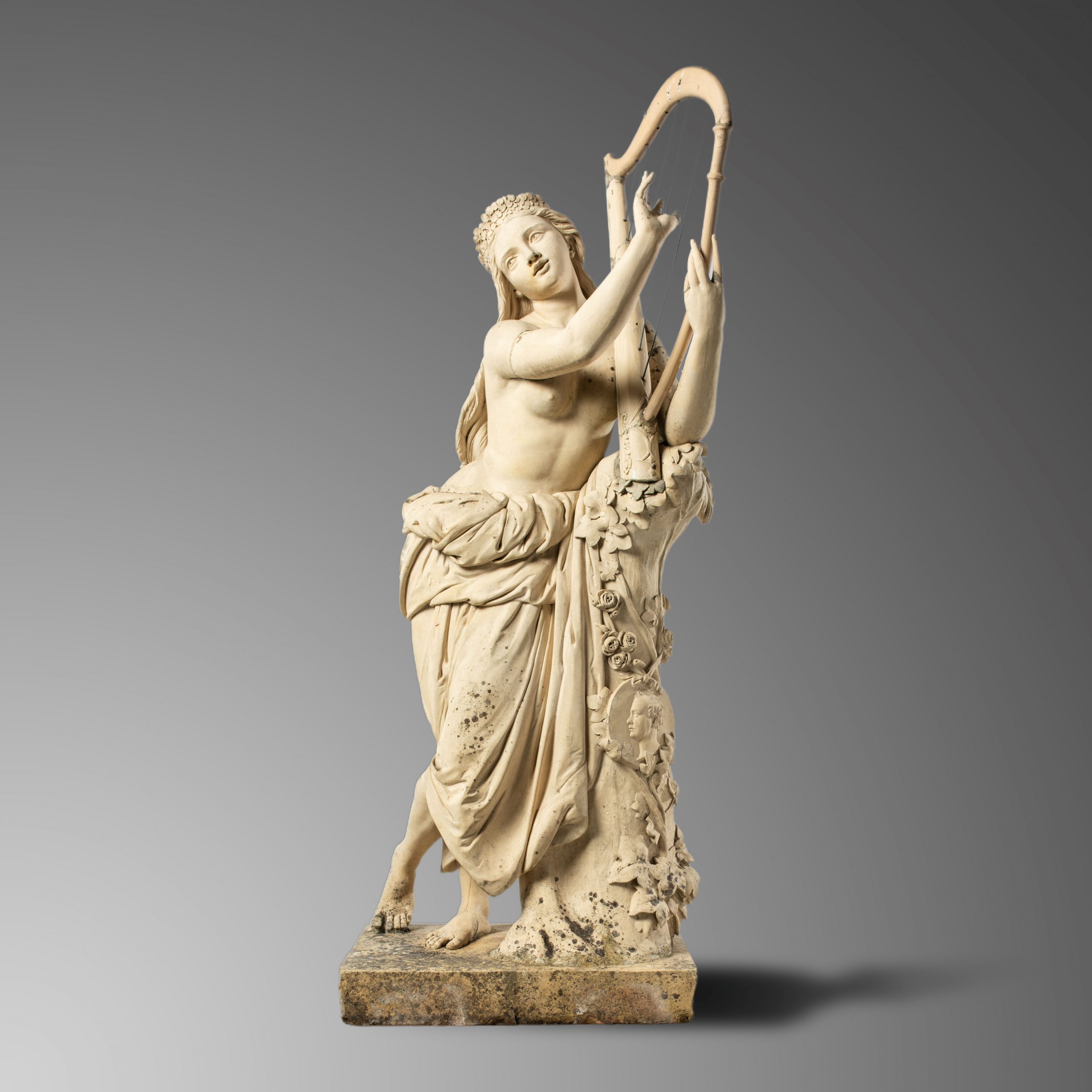 A rare Blashfield figure of girl playing the harp