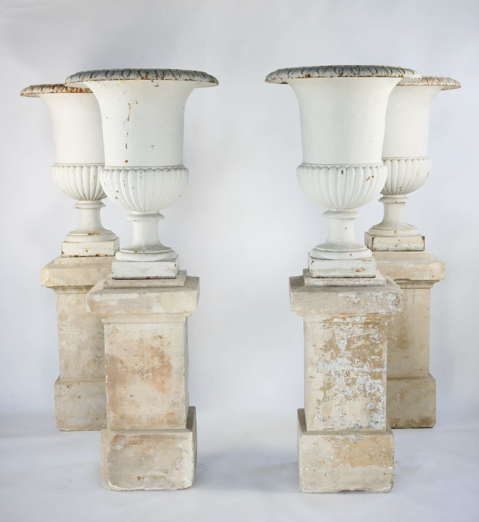 A set of 4 large cast iron urns