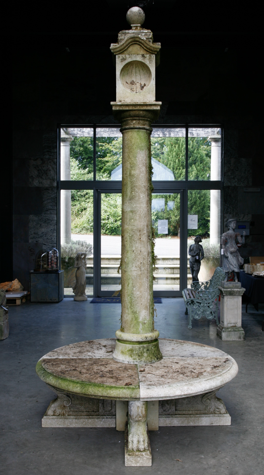 † A carved limestone pillar sundial (dagger lot)
